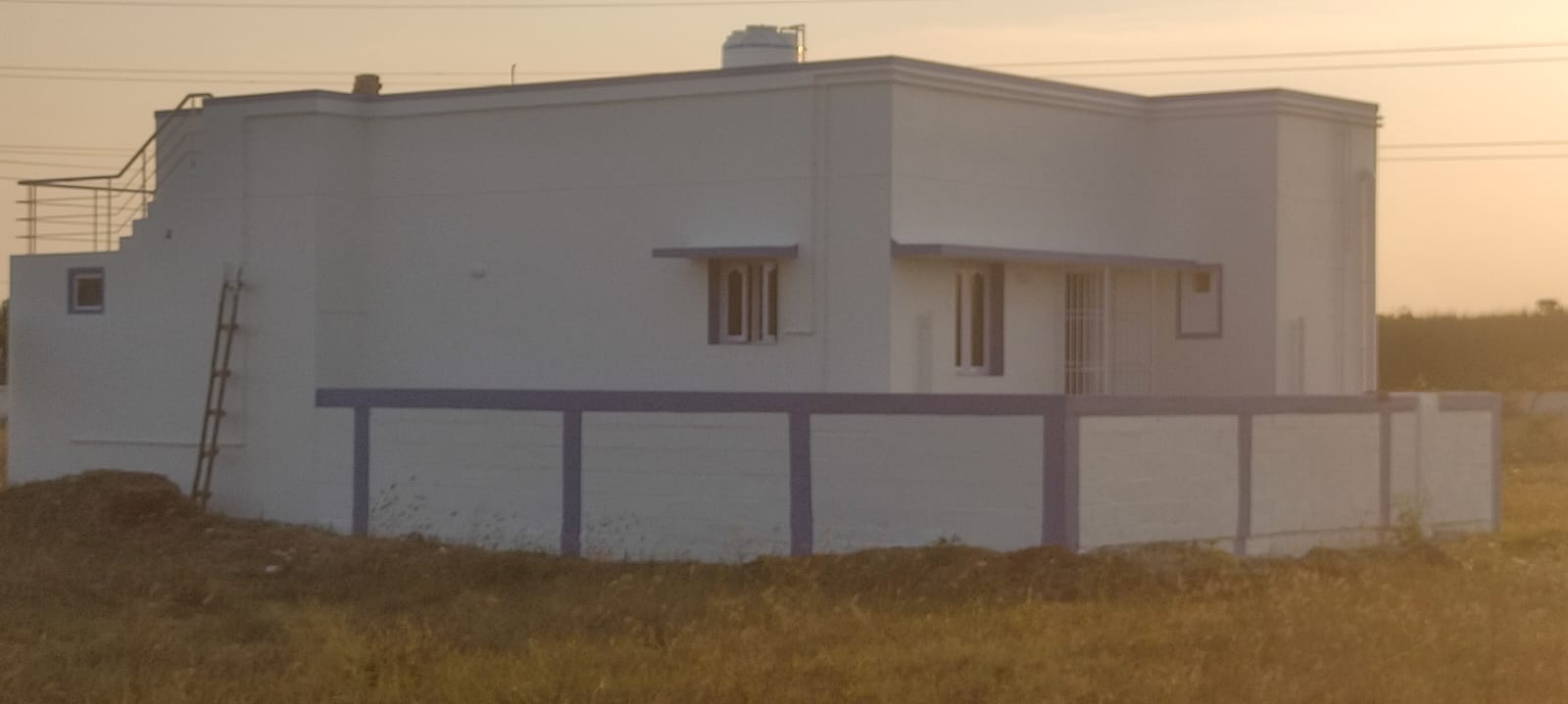 Side profile of a completed independent home at sunset