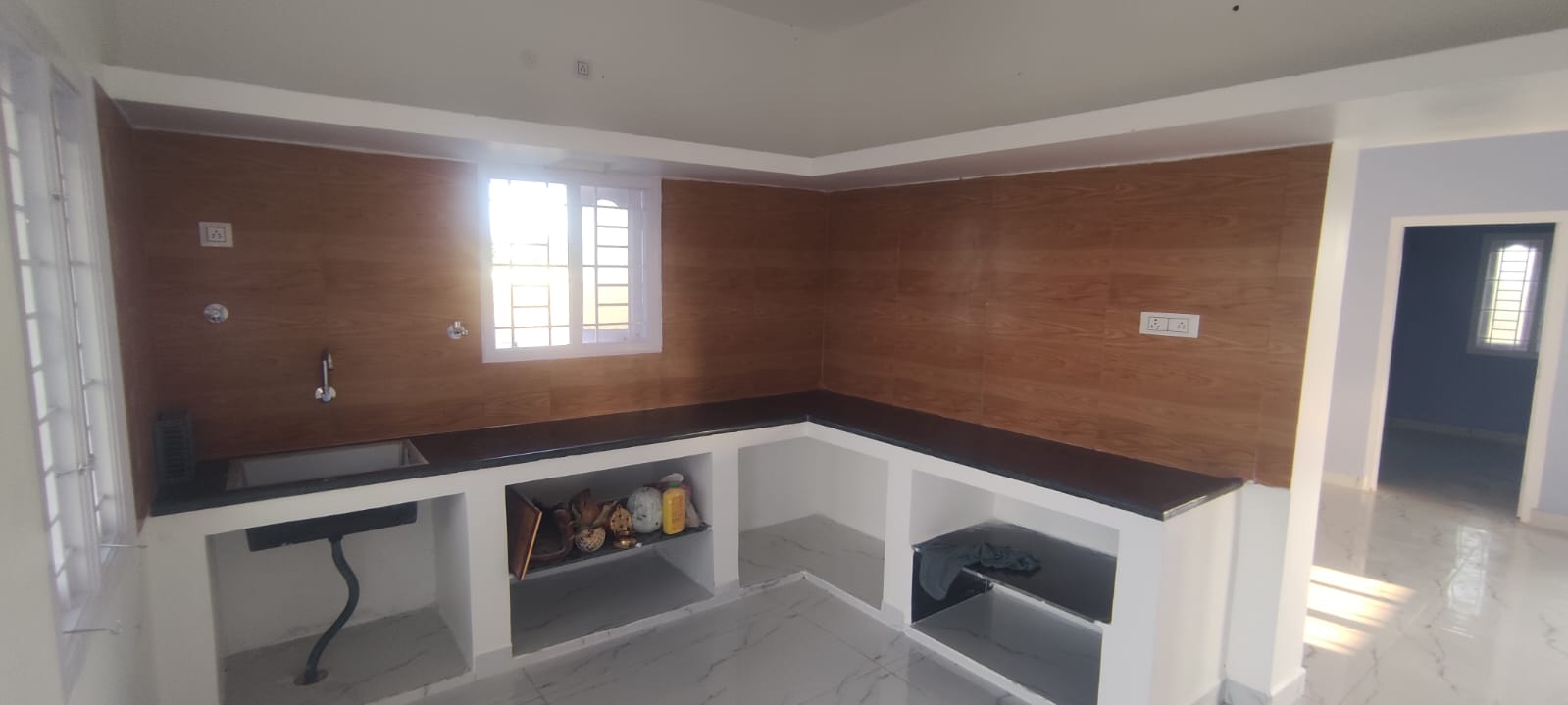 Modern kitchen with granite counter and marble flooring
